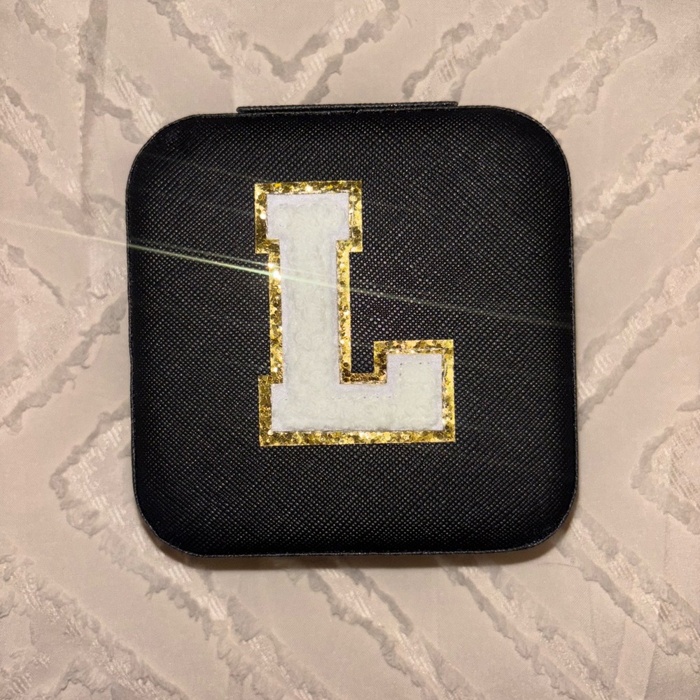Black Case with Gold and White Letter L